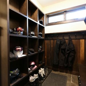 Custom designed wood paneled bootroom boot room with great storage in ski chalet at Feathertop