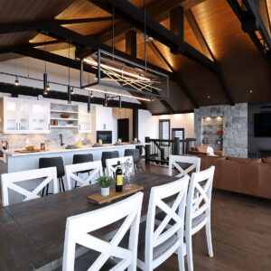 Open concept kitchen & dining created Big White Custom chalet builder near me & Kelowna custom home designer