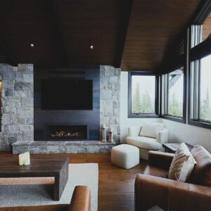 Rock fireplace & panoramic views created by Kelowna & Big White Custom home builder designer