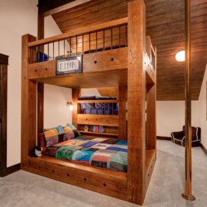 Double bunk beds with fire pole exit designed by Big White chalet builder Kelowna custom home builder designer