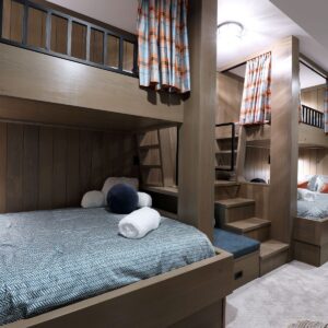Single over double wood bunk beds designed & built by Big White luxury home builder & Kelowna custom home builder designer