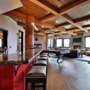 Granite countertops on bar in games room design designed by Kelowna home builder & Big White custom home builder designer