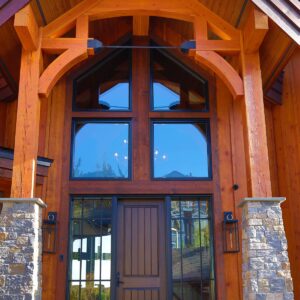 Wood timbers in front door design built by Kelowna home builder & Big White custom home builder designer