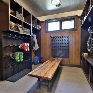 Custom designed wood boot room with ski boot dryer