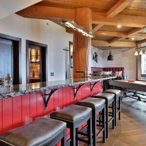 Large bar in games room created by Big White custom chalet builder & Kelowna builder near me