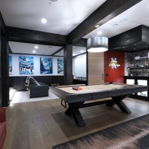 Large entertainment space with bar in ski chalet created by Kelowna & Big White Custom home builder designer