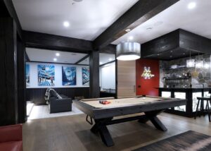 Custom designed home theatre & games room in ski chalet created by Kelowna & Big White Custom home builder designer