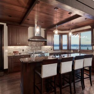Large kitchen island design in open concept kitchen design built by Big white custom ski chalet builder near me & Kelowna custom builder