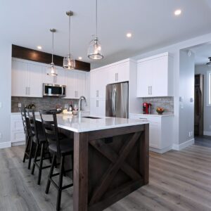 Wood gable end on kitchen island created by created by Big White chalet builder & Kelowna home builder & home designer