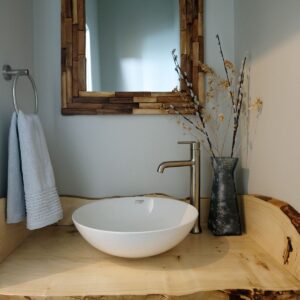 Modern bathroom with rustic accents built by Big White custom chalet builder & Kelowna custom home builder & home designer