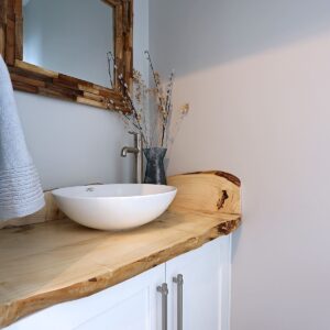Live edge wood countertops in ski chalet designed by Big White custom home builder & Kelowna construction company & home designer