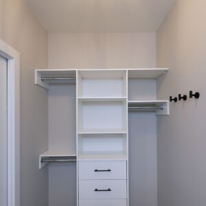 Custom wood closet organizer in master walk-in closet built by Big White builder near me & Kelowna builder & Custom home designer Weninger Construction & Design