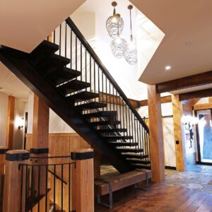 Custom timber staircase design in ski chalet built by Big White custom home builder & Kelowna home builder & home designer
