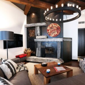 Wood fireplace in ski chalet designed by Big White custom chalet builder & Kelowna builder & home designer