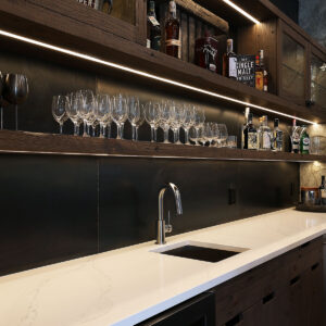 Bar with granite countertops in Feathertop Ski chalet created by Kelowna & Big White Custom home design builder designer