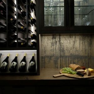 Under cabinets lighting w darkwood cabinets in wine room in ski chalet built by Big White builder & Kelowna builder & home designer