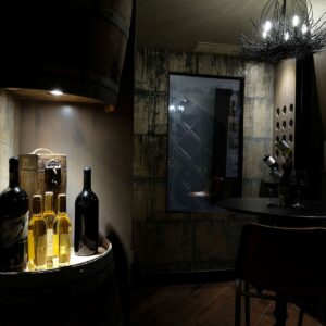 Wine room display & wood wine storage designed by Big White custom chalet builder & Kelowna custom home builder & home designer