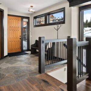 Wood doors in front entry installed by Big White, BC custom home builder & Kelowna custom home builder designer