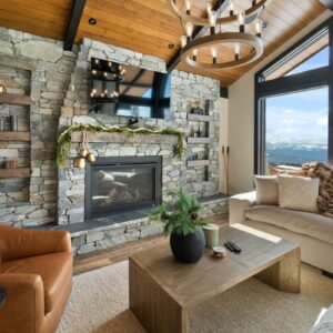Rock fireplace & living room designed by Big White, BC custom home builder & Kelowna custom home builder designer