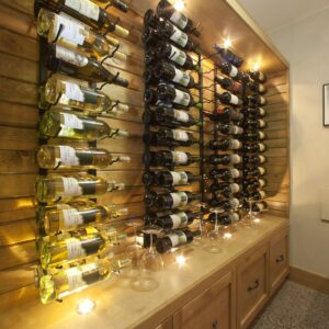 Unique display wine rack in custom wine room design built by Kelowna home builder & Kelowna Contractor
