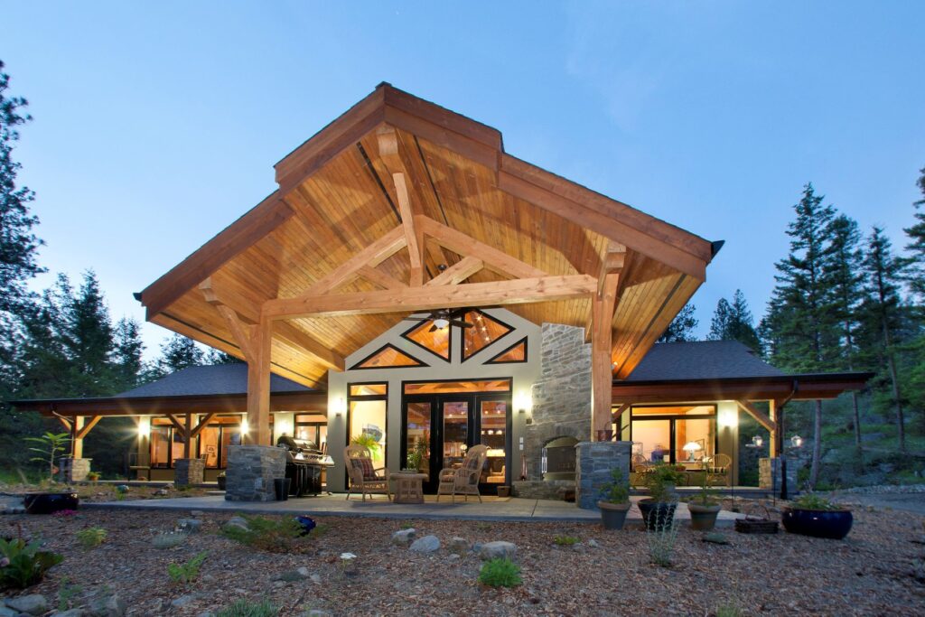 Custom design build featuring timber rafters & wood soffits in timber frame home in Kelowna, BC built by Kelowna custom home builder