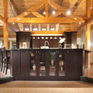 Timber rafter ceiling feature in open concept kitchen design built by Kelowna custom home builder & Kelowna construction company