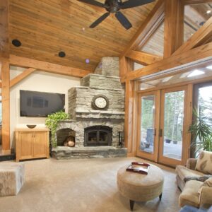 Wood T&G ceilings in open concept living room Unique display wine rack in custom wine room design built by Kelowna home builder & Kelowna Contractor