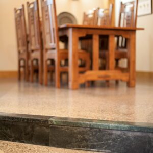Custom soapstone nosings and polished concrete floors in timberframe Unique display wine rack in custom wine room design built by Kelowna custom home builder & Kelowna Contractor