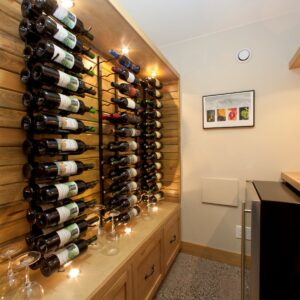 Wine room in custom timber frame house in Kelowna, BC built by Unique display wine rack in custom wine room design built by Kelowna home builder & Kelowna Contractor