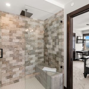 Custom tiled shower with bench built by Big White BC & Kelowna custom home builder designer
