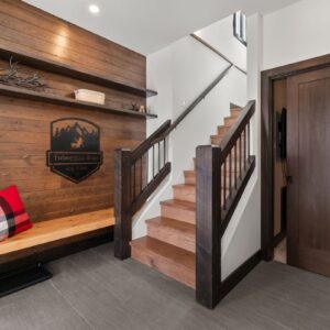 Rustic front entry in chalet designed by Big White custom home builder & Kelowna custom home builder designer