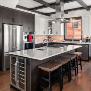 Kitchen island & breakfast bar combo designed by Big White custom home builder & Kelowna custom home builder designer