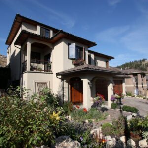 Front entry of tuscan designed custom home in Kelowna, BC designed and built by Kelowna custom home builder & Kelowna contractor