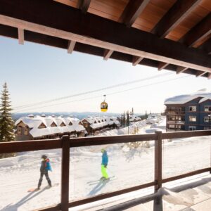 Glass railing design for ski chalet deck design by Big White custom chalet builder & Kelowna custom home builder & custom home designer