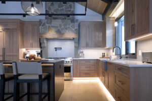 Sleek modern kitchen meets rustic kitchen in ski chalet at Big White SKi Resort. Built by custom builder Weninger Construction & Design Ltd.