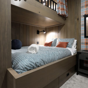 Close up of timber custom bunk beds with wood wall cladding