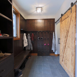 Ski chalet custom entry boot room with benches and storage