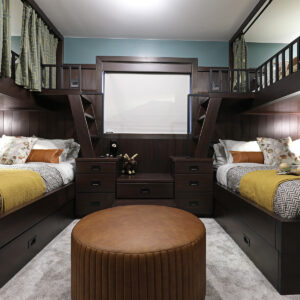 Custom bunk room with privacy curtains on upper bunk.