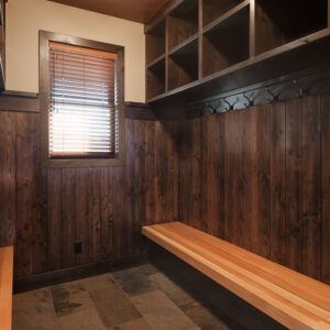 Clean ski chalet bootroom with storage and wood benches
